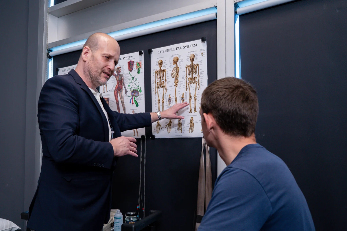 Physical therapist consulting with a patient during initial treatment plan review at Chatsworth Physical Therapy in Chatsworth CA